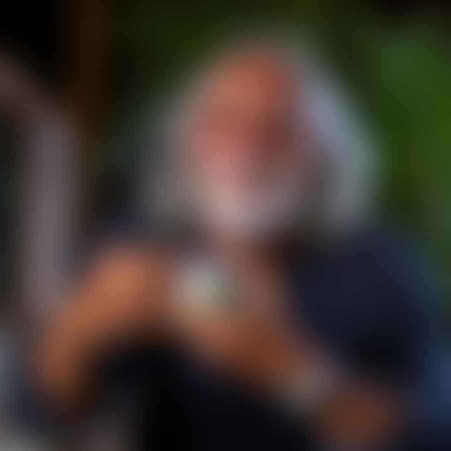 Tommy Chong posing with a cannabis product